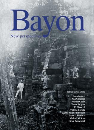Bayon Temple in Angkor Thom, Cambodia, with two figures standing on rocks, on cover of 'Bayon', by River Books.