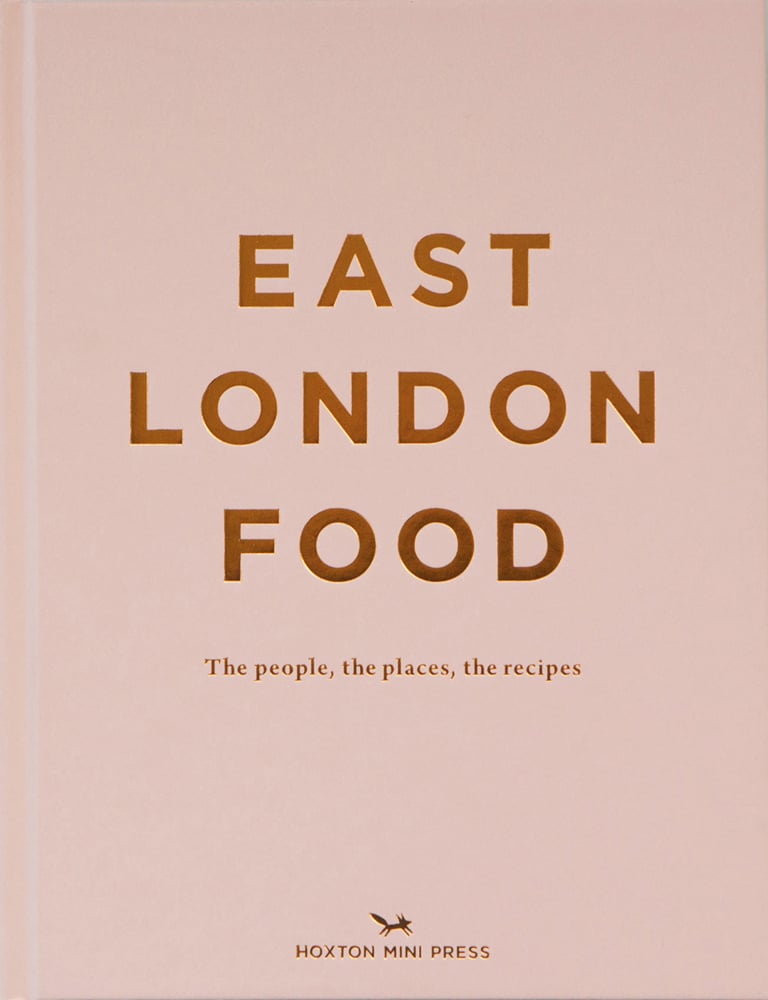 Gold capitalized font to centre of pale pink food guide cover of 'East London Food, The people, the places, the recipes', by Hoxton Mini Press.