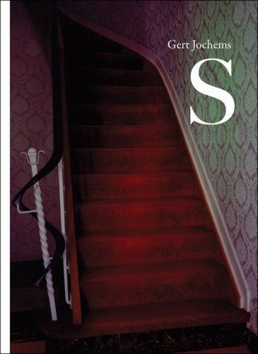 Dimly lit interior home with red carpeted staircase, on cover of 'S: Gert Jochems', by Hannibal Books.