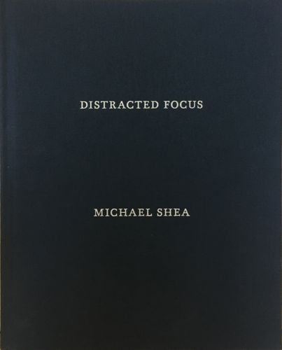 DISTRACTED FOCUS MICHAEL SHEA in silver font on black cover