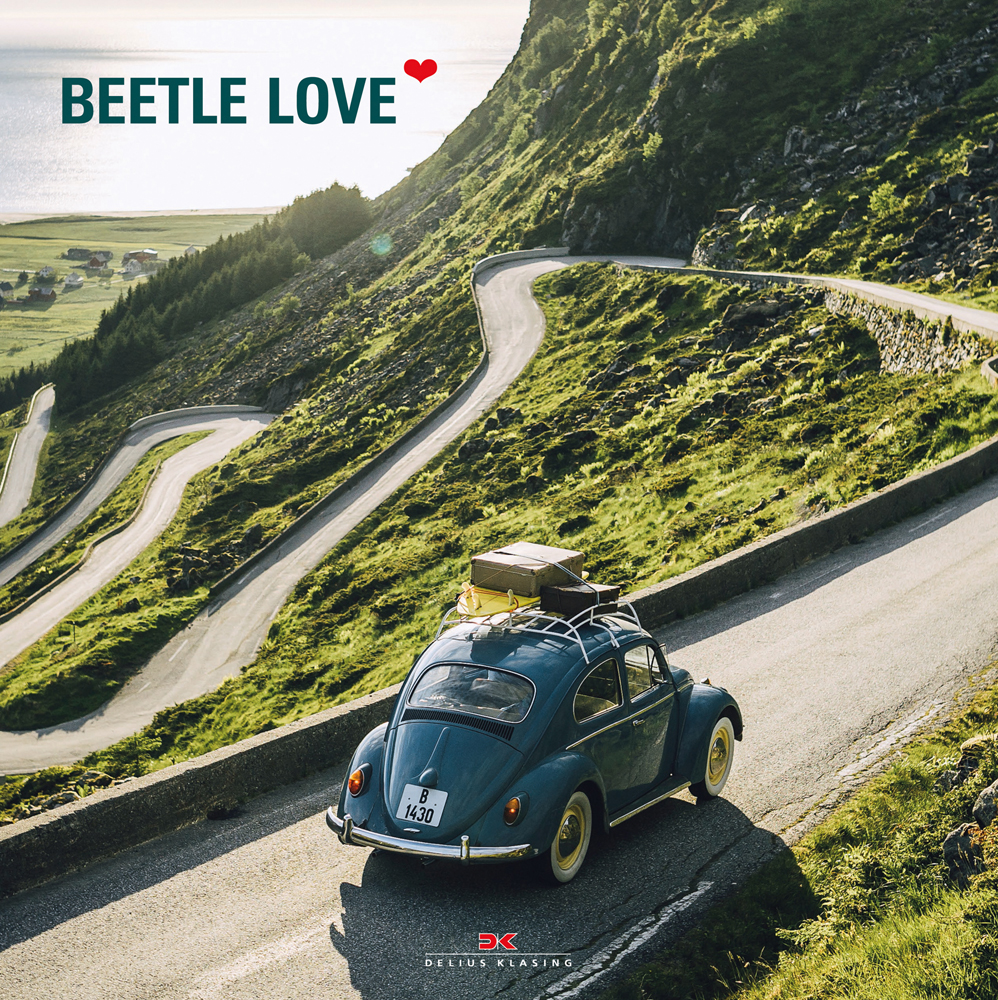 Blue VW Beetle driving on winding road, with hilly landscape around, on cover of 'Beetle Love', by Delius Klasing.