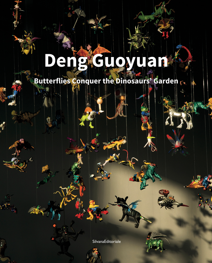Art installation of plastic dinosaur toys suspended from threads, Deng Guoyuan: The Butterflies conquer the Dinosaur's Garden in white font above.