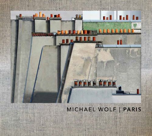 Grey linen landscape book cover of Paris, featuring rooftops with rows of small terracotta chimney pots. Published by 5 Continents Editions.