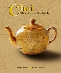 Book cover of Chai: The Experience of Indian Tea, with a gold teapot featuring a map of India. Published by Niyogi Books.
