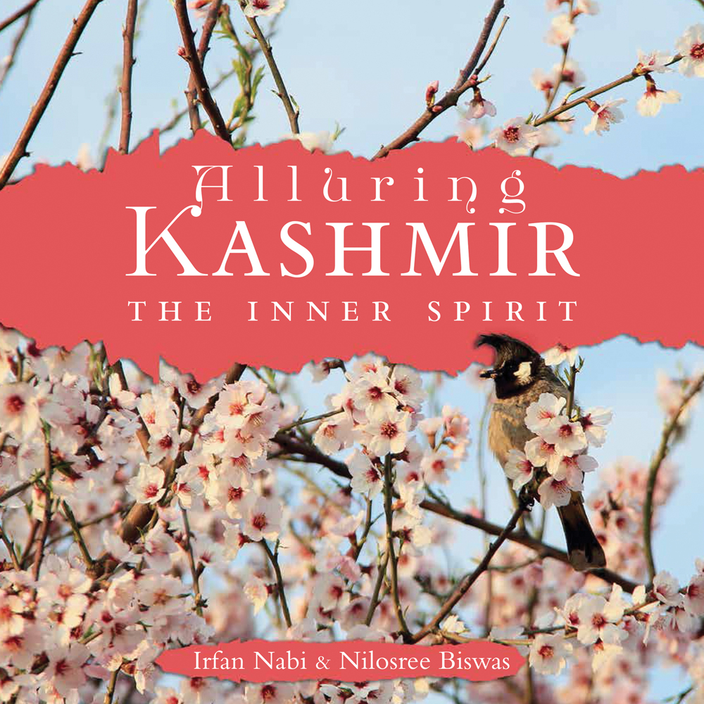Book cover of Alluring Kashmir: The Inner Spirit, with a blossom tree. Published by Niyogi Books.