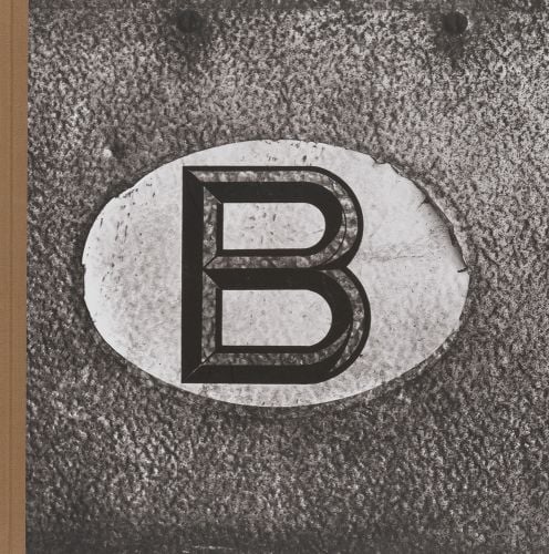 Large letter 'B' to centre of grey textured cover of 'Belgicum', by Hannibal Books.