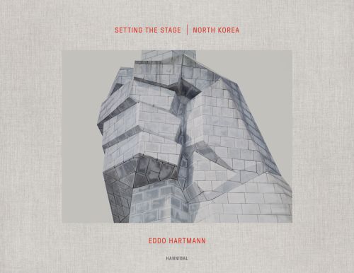 Drawing of fist in brickwork on pale grey cover, Setting the Stage: North Korea Eddo Hartmann in orange font