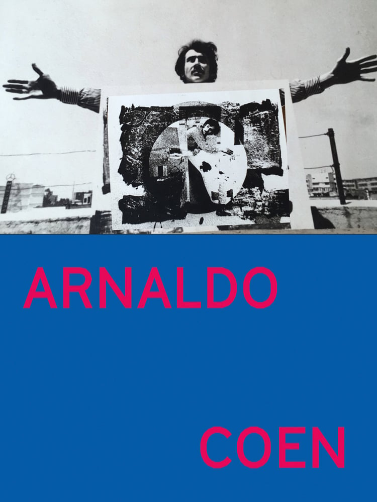 Arnaldo Coen holding his arms out, picture in front of him, on cover of 'Arnaldo Coen', by Turner.
