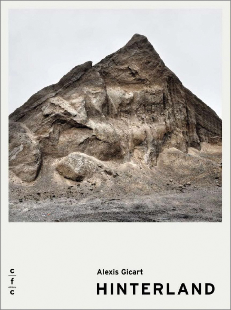 Book cover of Alexis Gicart: Hinterland, with peaked rock formation. Published by Exhibitions International.
