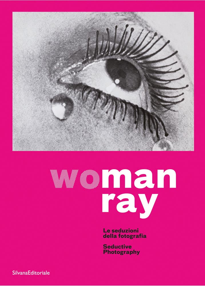 Les larmes by Man Ray, close up of female eye with long spidery eyelashes, on pink cover, woman ray in pink and white font below.