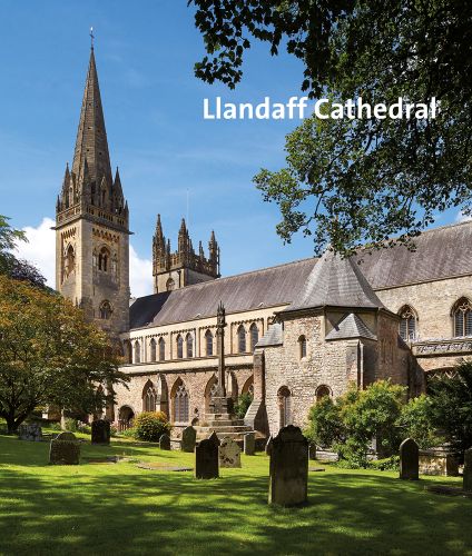 Llandaff Cathedral surrounded by gravestones and trees, under blue sky, Llandaff Cathedral in white font to top right.