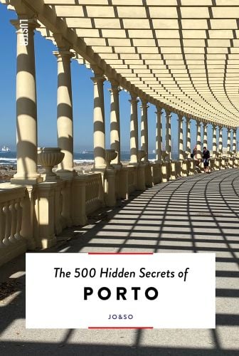 Columned balustrade in sun and The 500 Hidden Secrets of Porto in black font on white banner below