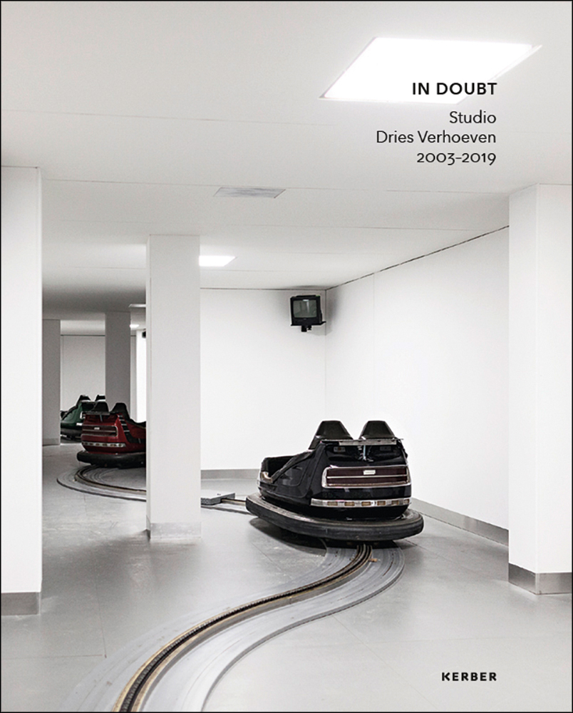 3 bumper cars on track in white interior space, IN DOUBT Studio Dries Verhoeven 2003-2019 in black font to upper right.