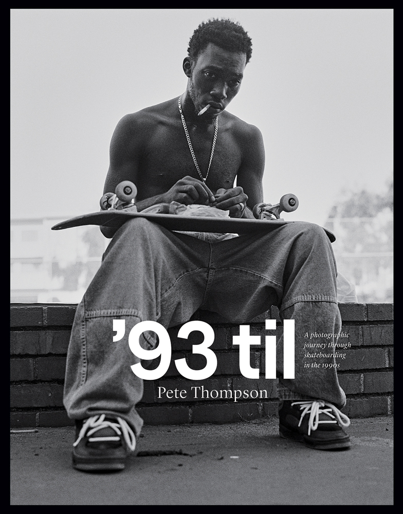 Professional skateboarder Stevie Williams sitting on low brick wall smoking cigarette, with his board upside down on lap, on cover of '93 til, A Photographic Journey Through Skateboarding in the 1990s', by ORO Editions.