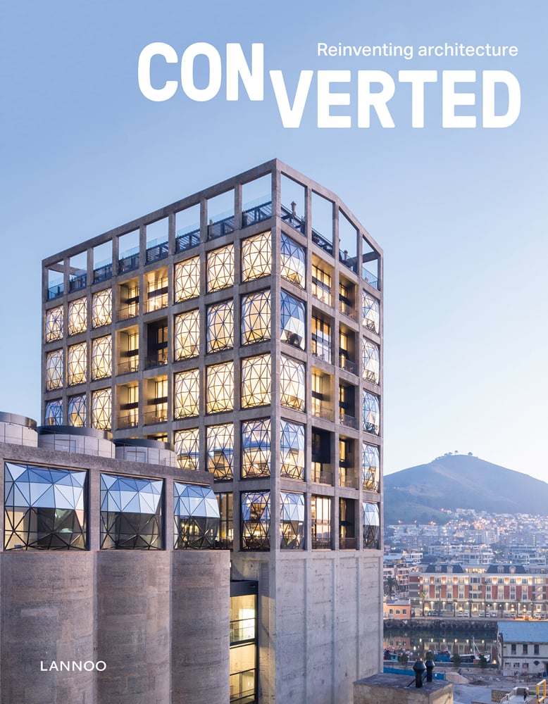 Modern high rise building of Zeitz MOCAA museum with geometric panelled glass, on cover of 'Converted. Reinventing architecture', by Lannoo Publishers.