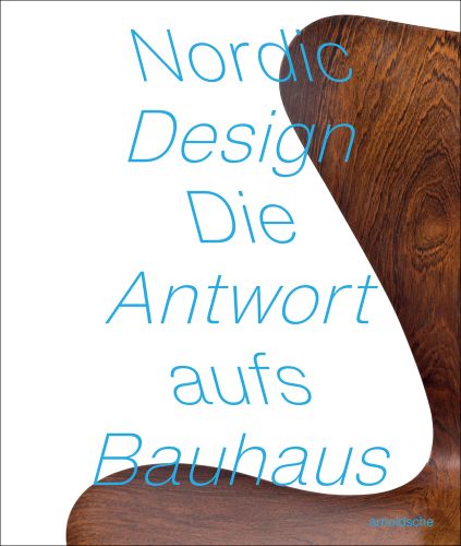 Portion of curved wood chair, white cover, Nordic Design Die Antwort aufs Bauhaus in blue font.