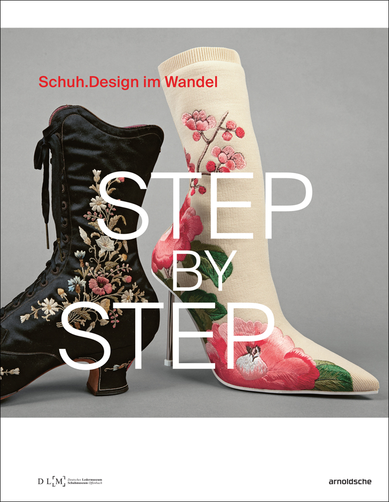 Black silk embroidered Victorian laced boot and modern cream floral stiletto boot, grey cover, Schuh. Design im Wandel in red font above.