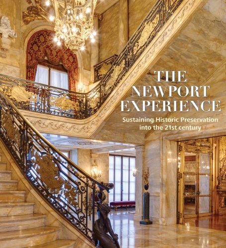 Stunning bright marbled interior with grand staircase and gold fittings with The Newport Experience in white font