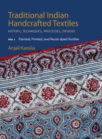 Book cover of Traditional Indian Handcrafted Textile: History, Techniques, Processes, and Designs, with a decorative fabric in red and pale blue. Published by Niyogi Books.