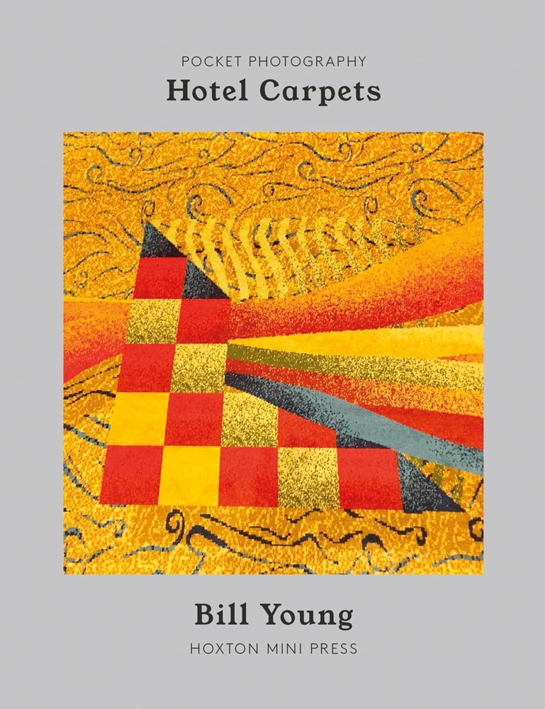 Bright yellow and orange tiled carpet design, on grey cover of 'Hotel Carpets', by Hoxton Mini Press.