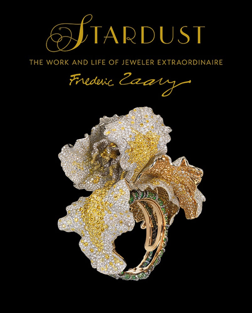 Luxurious jewel encrusted Diamond and gold bangle, on black cover, STARDUST THE WORK AND LIFE OF JEWELER EXTRAORDINAIRE Frédéric Zaavy in gold font above.
