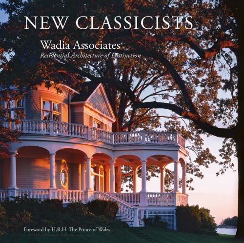 Queen Anne style home illuminated by dusky pink evening sky, large tree in foreground, NEW CLASSICISTS Wadia Associates Residential Architecture of Distinction in white font above.