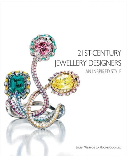 Small diamond encrusted jewellery piece with three larger gemstones, on cover of '21st-Century Jewellery Designers An Inspired Style', by ACC Art Books.