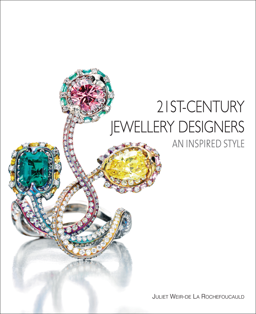 Small diamond encrusted jewellery piece with three larger gemstones, on cover of '21st-Century Jewellery Designers An Inspired Style', by ACC Art Books.