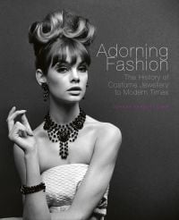 Book cover of Adorning Fashion: The History of Costume Jewellery to Modern Times, featuring Jean Shrimpton modelling large beaded jewelry for ‘Voice & Vision’, John French, 1963. Published by ACC Art Books.