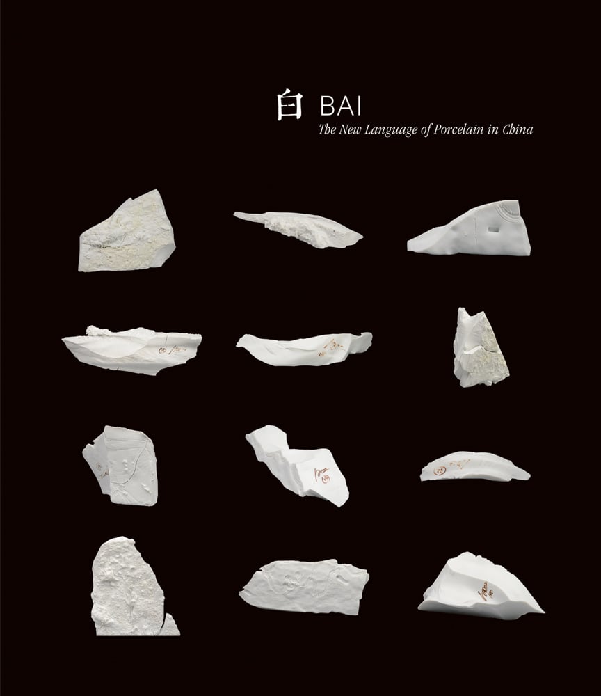12 white shards of ceramic on black cover of 'Bai: The New Language of Porcelain in China', by ACC Art Books.