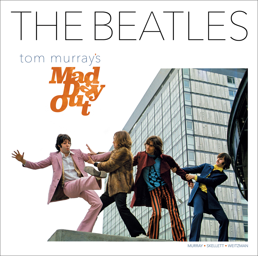 Fun colour landscape photo of the four Beatles on top of a roof linking arms to pull Paul McCartney away from the edge with The Beatles Tom Murray's Mad Day Out in black and orange font