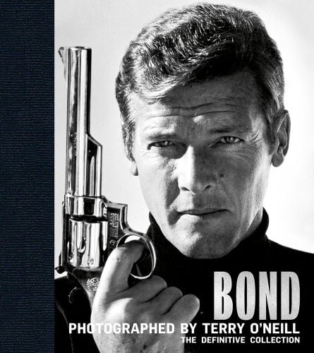 Black and white portrait of Roger Moore as James Bond holding a silver gun gazing confidently at the camera with Bond: Photographed by Terry O'Neill The Definitive Collection in grey font