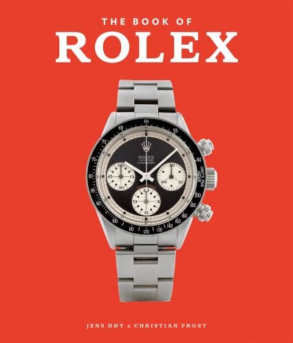 Silver and black Rolex watch on mars red cover, 'The Book of Rolex' in white font above, by ACC Art Books.