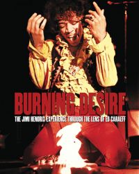 Iconic shot of rock guitar legend Jimi Hendrix kneeling in front of his Fender Stratocaster, which he has set alight, on cover of 'Burning Desire - Jimi Hendrix', by ACC Art Books.