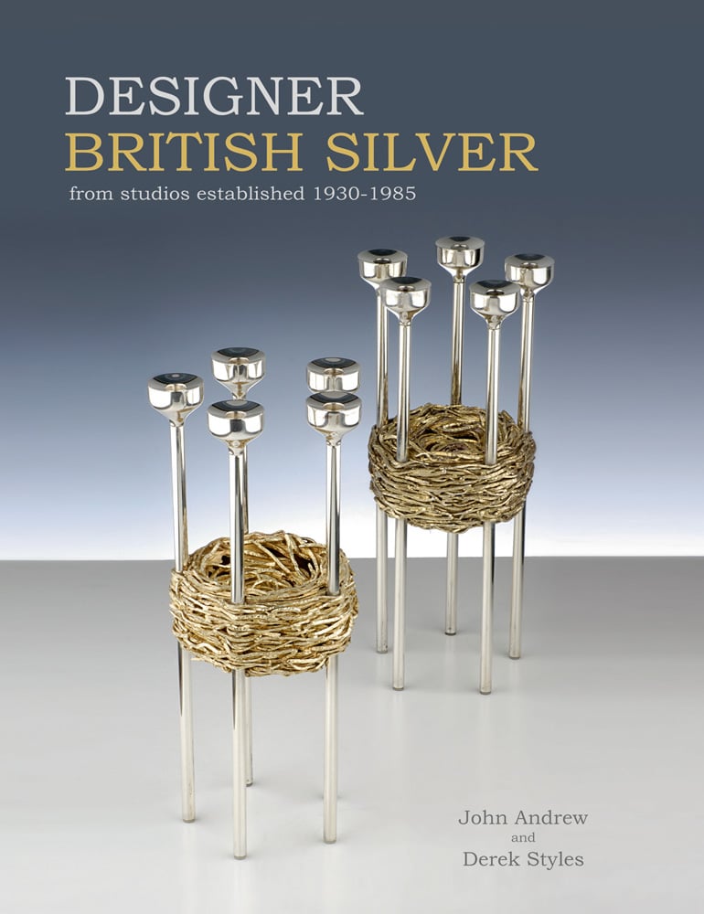Silver candlestick holder with nest shape to centre, on cover of 'Designer British Silver', by ACC Art Books.