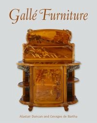 Sideboard in walnut, oak, and various woods, decorations of ears of wheat in patinated bronze, on cover of 'Gallé Furniture', by ACC Art Books.