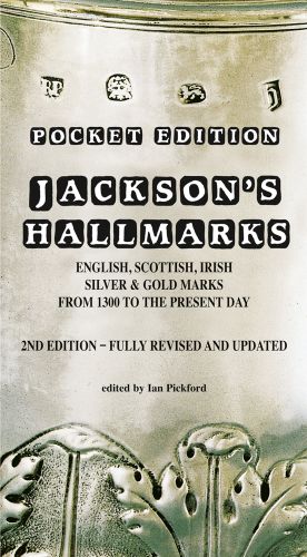 Stamped antique silver with decorative leaf design, on cover of 'Jackson’s Hallmarks, Pocket Edition', by ACC Art Books.