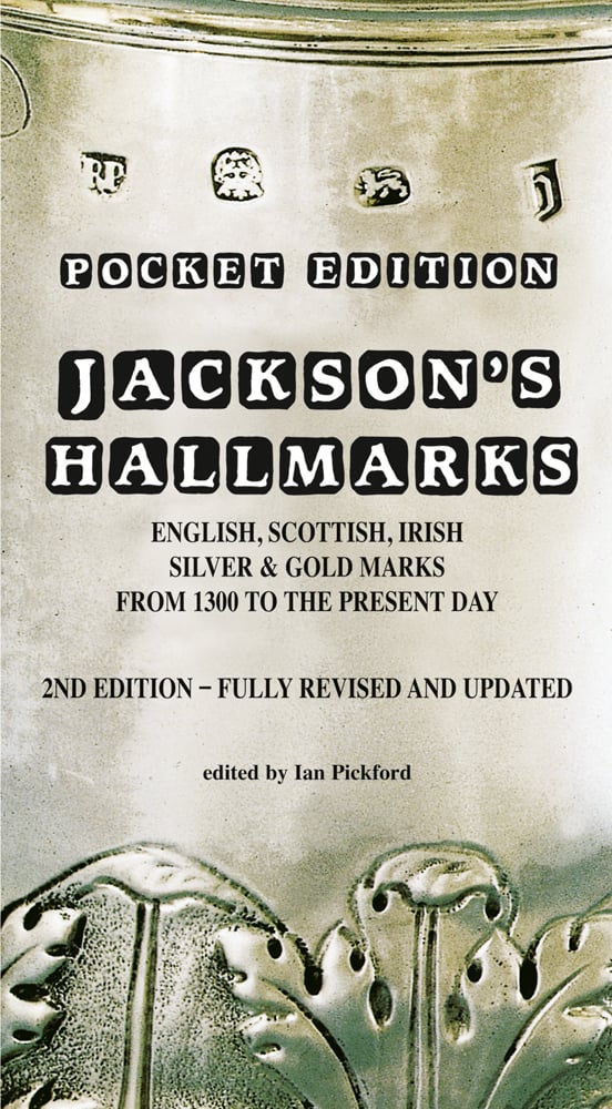 Stamped antique silver with decorative leaf design, on cover of 'Jackson’s Hallmarks, Pocket Edition', by ACC Art Books.