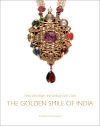 Pendant in the style of single flower on stem with a carved cabochon ruby in centre, on white cover of 'Traditional Indian Jewellery', by ACC Art Books.