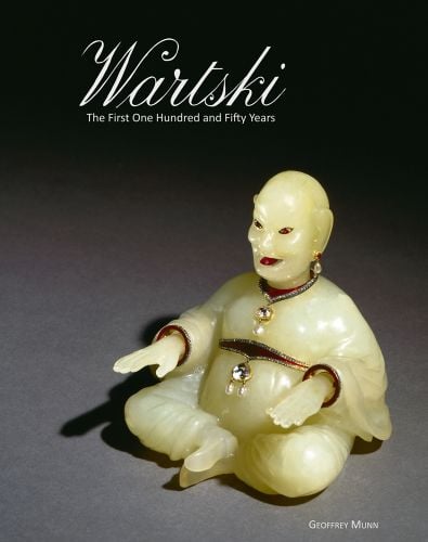 Peter Carl Fabergé bowenite Magot carved seated figurine circa 1910, on grey cover of 'Wartski', by ACC Art Books.