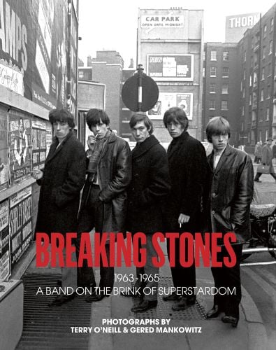Book cover of Breaking Stones, featuring The Rolling Stones with Brian Jones, standing on city street. Published by ACC Art Books.