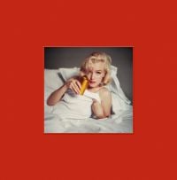 Milton H. Greene's photo 'The Bed Sitting, 1953', on red cover of 'The Essential Marilyn Monroe - The Bed Print', by ACC Art Books.