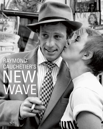 Jean Seberg kissing Jean Paul Belmondo's cheek on set from 1960 film 'Breathless', on cover of 'Raymond Cauchetier's New Wave', by ACC Art Books.