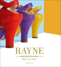 Three brightly colored high-heeled luxury shoes, in red, purple and yellow, on cover of 'Rayne', by ACC Art Books.
