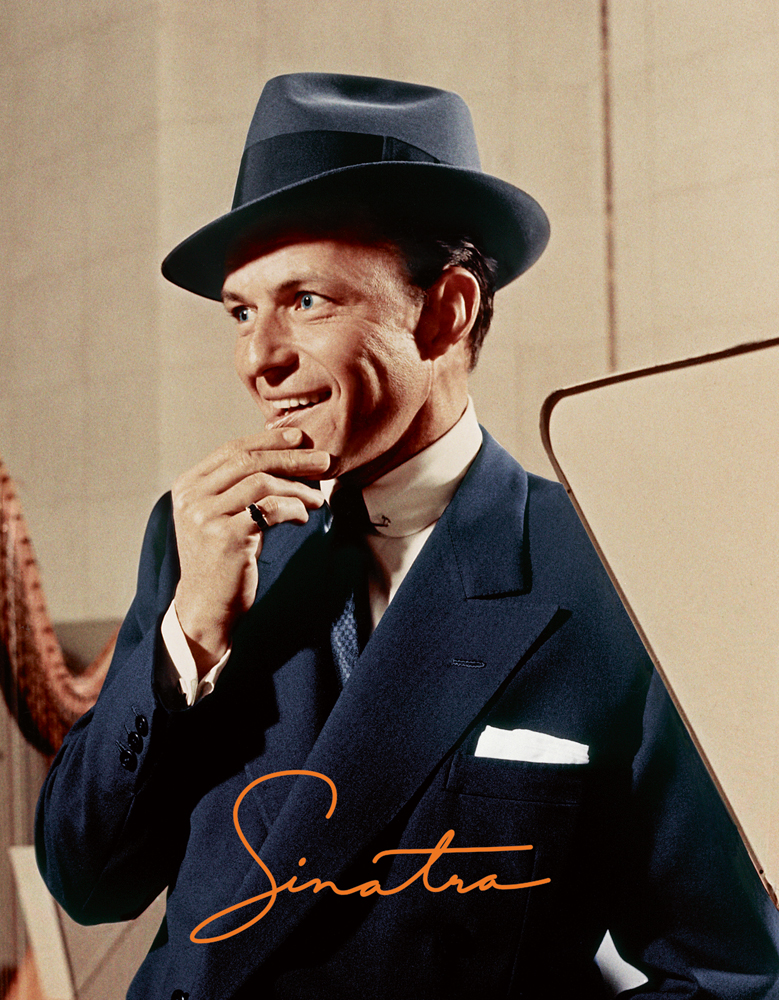 A dapper Frank Sinatra in a recording studio in 1956, in navy suit and hat, on cover of 'Sinatra', Sinatra's signature below, by ACC Art Books.
