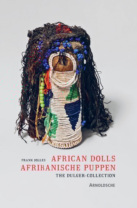 Book cover of African Dolls: The Dulger Collection, with a doll wrapped with white beads. Published by Arnoldsche Art Publishers.