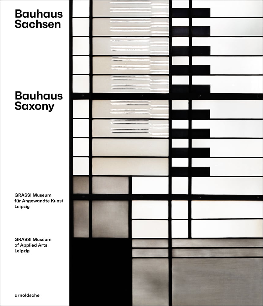 Abstract geometric pattern in white, black and grey, Bauhaus Saxony in black font to left white border