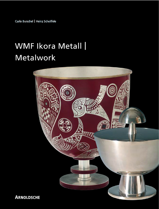 Metal cup with dark red and white pattern, chrome pot to right, on black cover of 'Ikora Metalwork by WMF' by Arnoldsche Art Publishers.