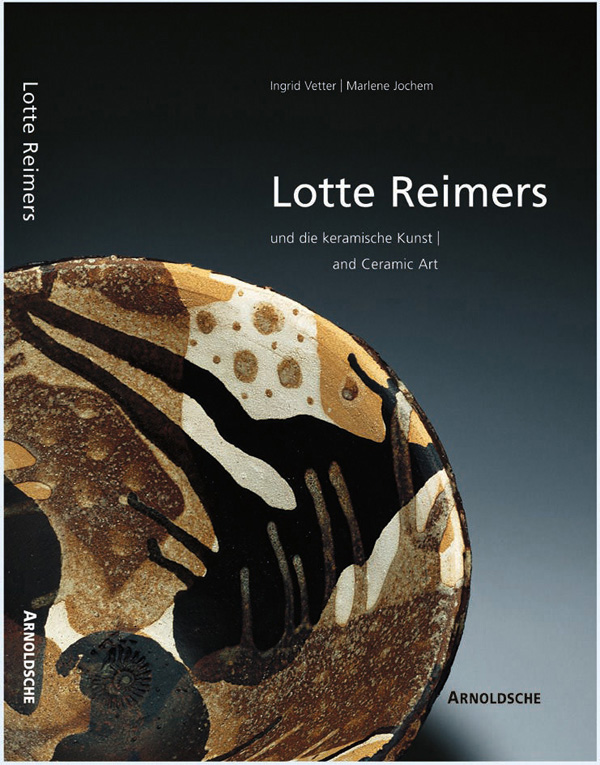 Ceramic bowl in black, beige, brown and cream, with ammonite impression to centre, on cover of 'Lotte Reimers, And Ceramic Art', by Arnoldsche Art Publishers.