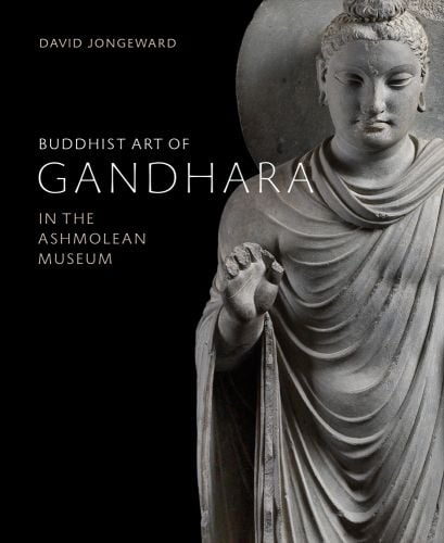 Pale grey carved Buddhist sculpture of robed man, on black cover of 'Buddhist Art of Gandhara, In the Ashmolean Museum', by Ashmolean Museum.